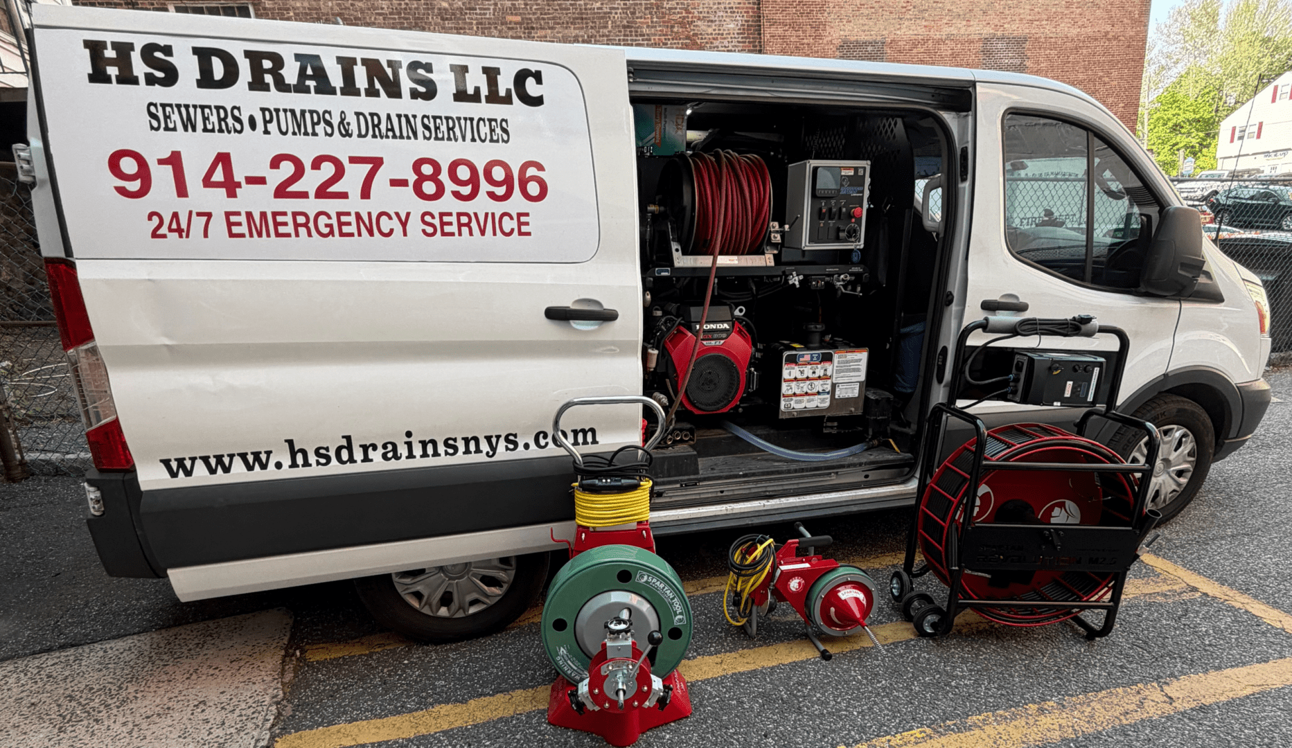 Drain service van with hoses and equipment